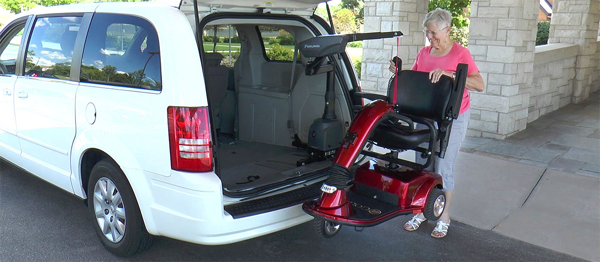 Bruno Curb-Sider scooter lift in front of a house