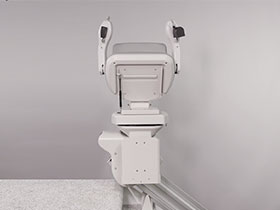 Bruno Elite straight stairlift folded up on steps