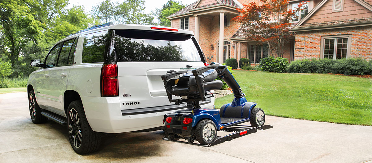 Bruno Out-Sider scooter lift in front of a house